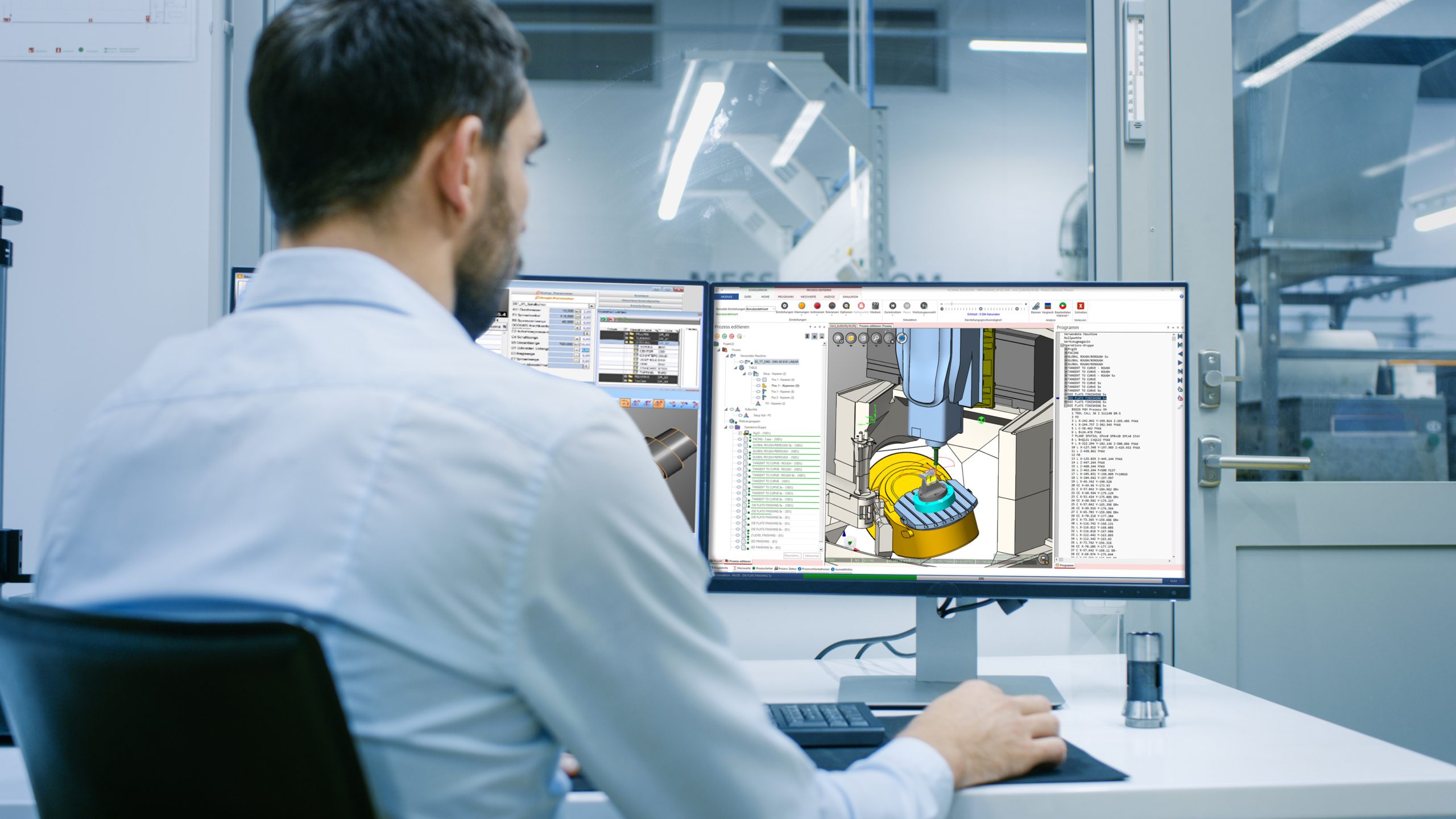 Engineer/ Technician Working on a Personal Computer with Two Dis
